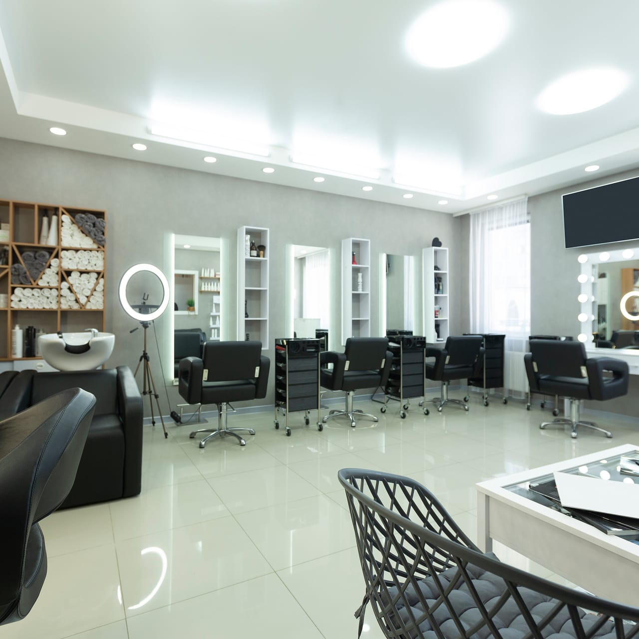 Interior of modern hair salon with barber armchair, free space